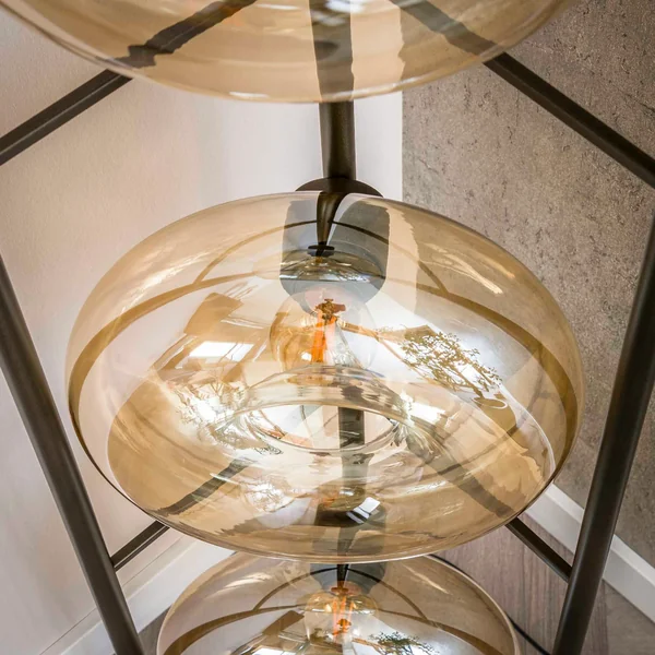 Lampadaire vintage anneaux en verre ambré NIAGARA